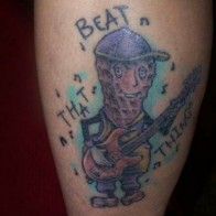 Beat that thing pickle guitar Funny Tattoos regrettable bad tattoos terrible awful ugliest tattoos wtf tattoos, horrible tattoos awkward family photos america's worst tattoos photos crazy people weird people stupid humor redneck humor