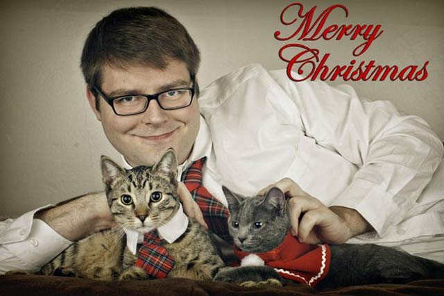 Man with Cat Card ~ 27 Funny & Creep Family Christmas Photos