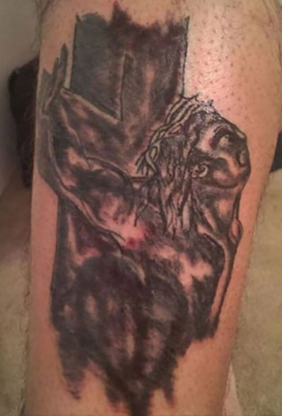 Bad Jesus nailed on the cross tattoo, black and burned worst