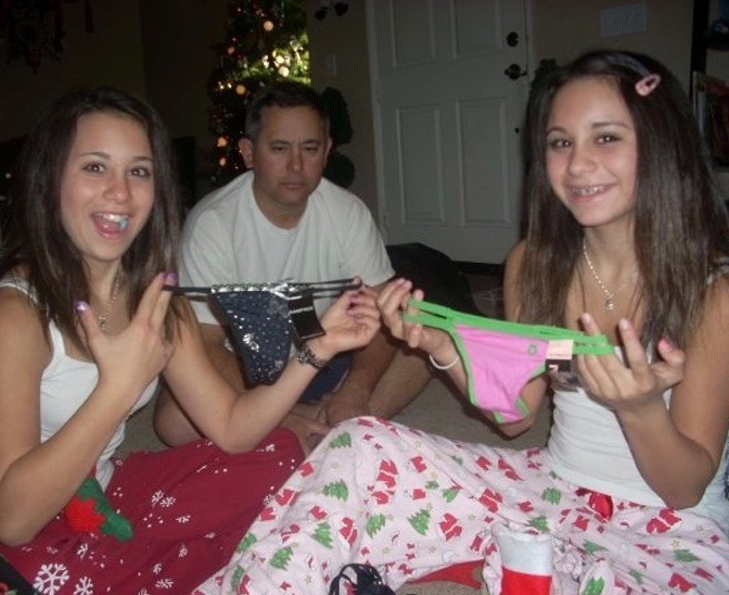 26 Funny Family Christmas Photos distraught dad with daughters who got thon...