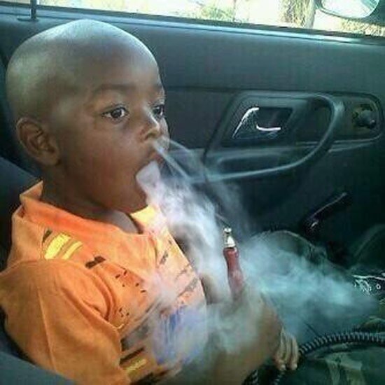young oy smoking from hookah pipe in car ~ Worst Parents Ever