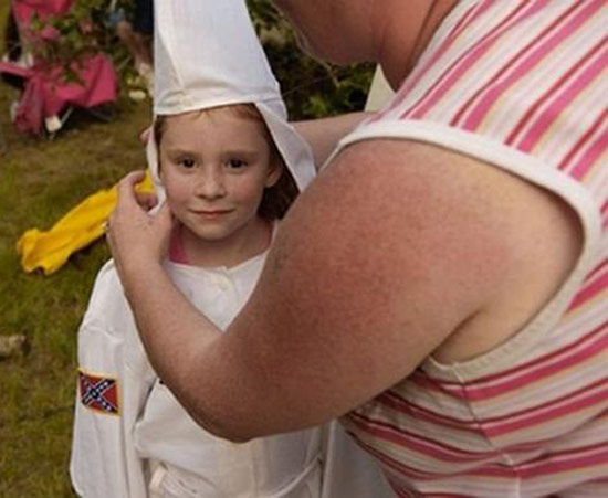 mom dressing boy girl in KKK robe ~ Worst Parents Ever