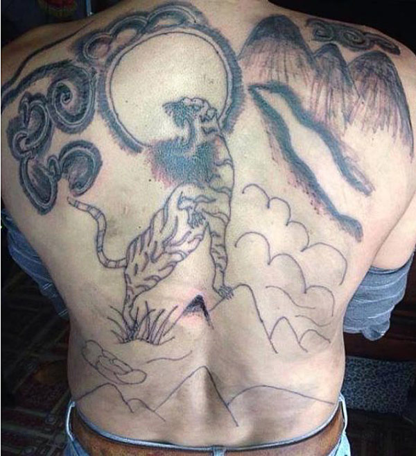 Bad Tiger tattoo on back_ bearded hipster tiger ~ the ugliest bad worst tattoos
